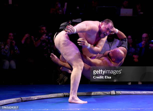 Soslan Gagloev of Russia celebrates his win as he sends Oosuna Arashi of Egypt out of ring during the Championship bout during the Club Sumo event at...