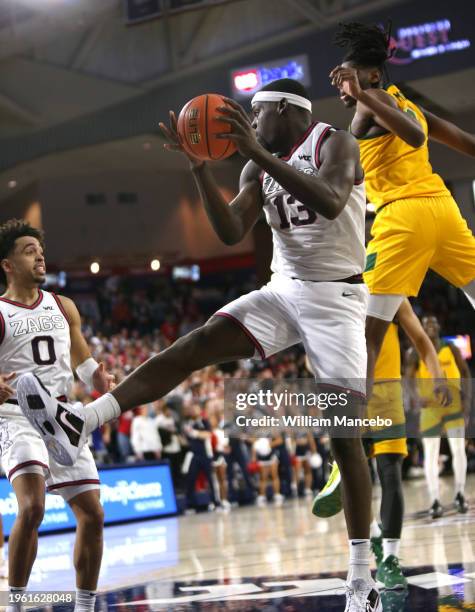 Graham Ike of the Gonzaga Bulldogs controls a rebound against the San Francisco Dons in the second half at McCarthey Athletic Center on January 25,...