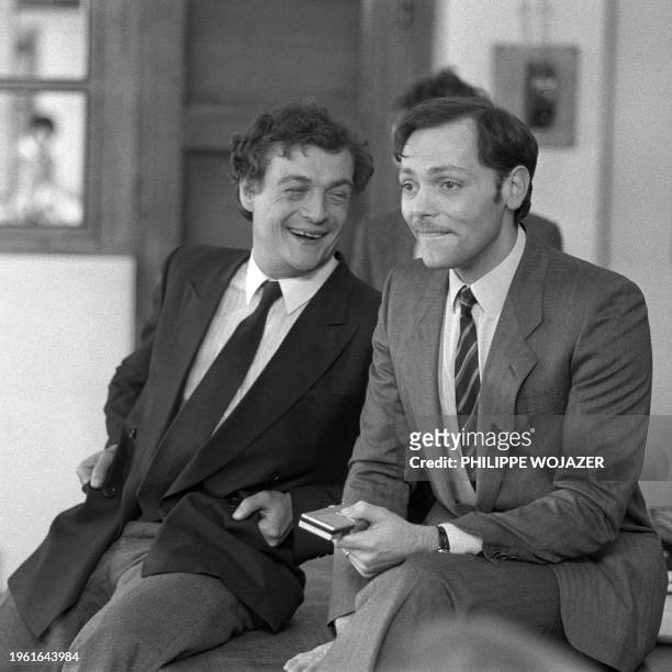 French actors Philippe Leotard and Patrick Dewaere joke on Mars 24, 1982 on the set of the movie "Le paradis pour tous" directed by Alain Jessua. AFP...