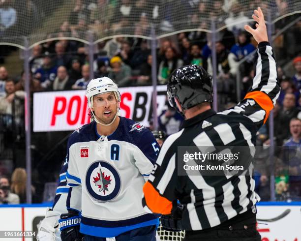 Brenden Dillon of the Winnipeg Jets reacts to a call by referee Jon McIsaac during the second period against the Toronto Maple Leafs at Scotiabank...