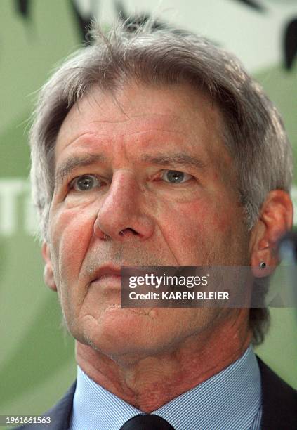 Actor Harrison Ford waits to address a crowd during the Tiger Conservation Initiative on June 9, 2008 at the National Zoo In Washington, DC. Harrison...