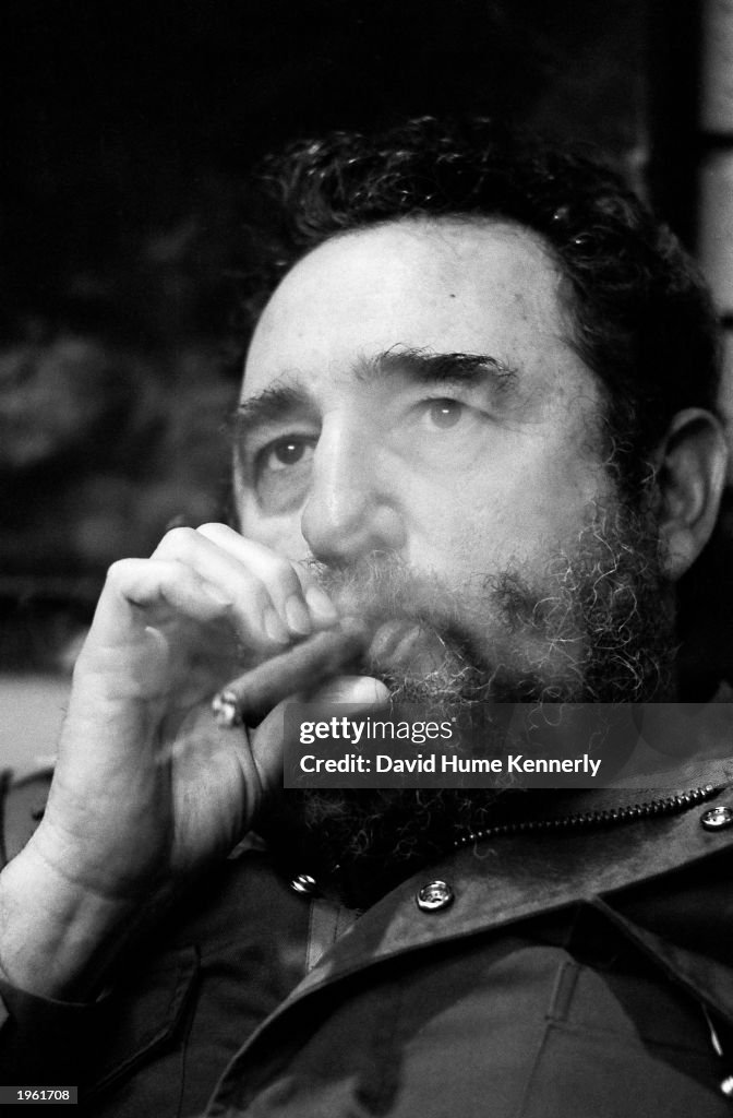 Fidel Castro Smokes A Cigar