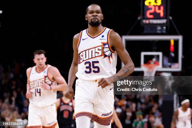 Kevin Durant of the Phoenix Suns reacts after hitting a three point basket during the game against the Chicago Bulls at Footprint Center on January...