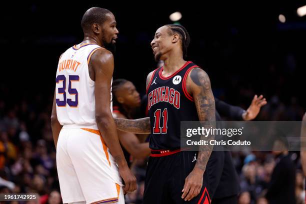 DeMar DeRozan of the Chicago Bulls talks with Kevin Durant of the Phoenix Suns during the game at Footprint Center on January 22, 2024 in Phoenix,...