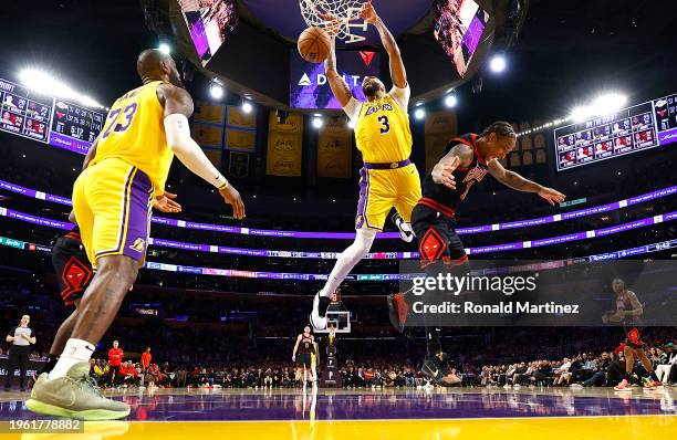 Anthony Davis of the Los Angeles Lakers makes a slam dunk against DeMar DeRozan of the Chicago Bulls in the second half at Crypto.com Arena on...