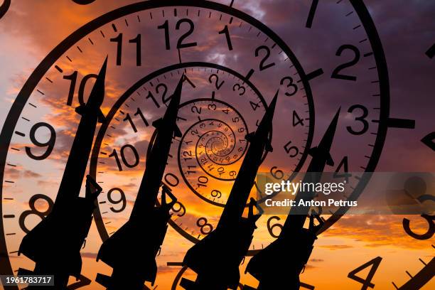 missiles on the background of clock - intercontinental ballistic missile stock pictures, royalty-free photos & images