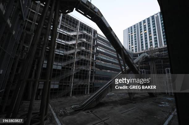 Escalators are seen in an abandoned Evergrande commercial complex in Beijing on January 29, 2024. A Hong Kong court on January 29 ordered the...