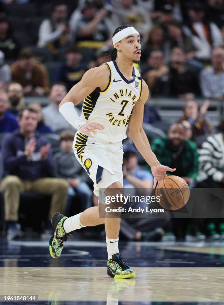 Andrew Nembhard of the Indiana Pacers dribbles the ball against the Philadelphia 76ers during the first half of the game at Gainbridge Fieldhouse on...