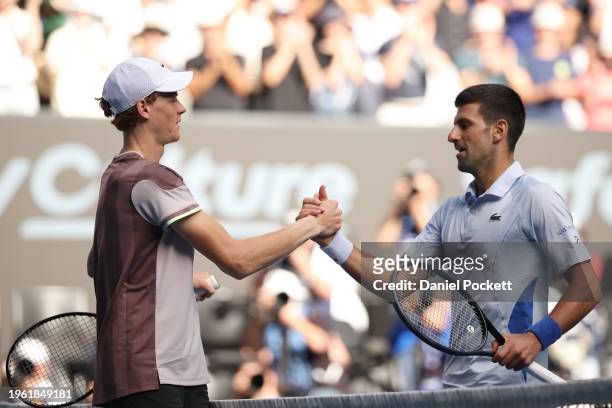 Jannik Sinner of Italy shakes hands with Novak Djokovic of Serbia in their Semifinal singles match during the 2024 Australian Open at Melbourne Park...
