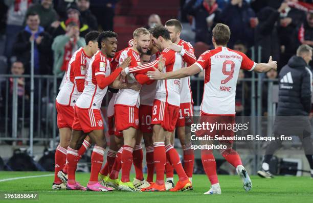 Raphael Guerreiro of FC Bayern München celebrates with teammates after scoring his teams first goal during the Bundesliga match between FC Bayern...