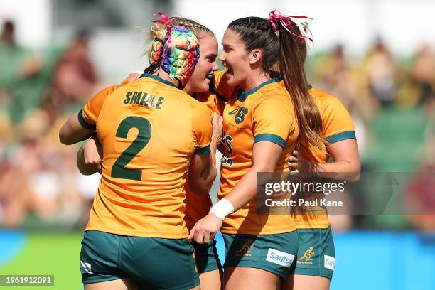 Heidi Dennis of Australia celebrates a try with team mates during the 2024 Perth SVNS women's match between Australia and South Africa at HBF Park on...