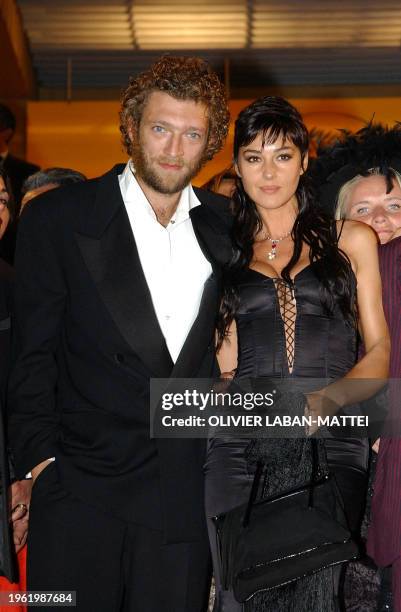 Italian actress Monica Bellucci and French actor Vincent Cassel leave the palais des festivals after the screening of their controversial film...