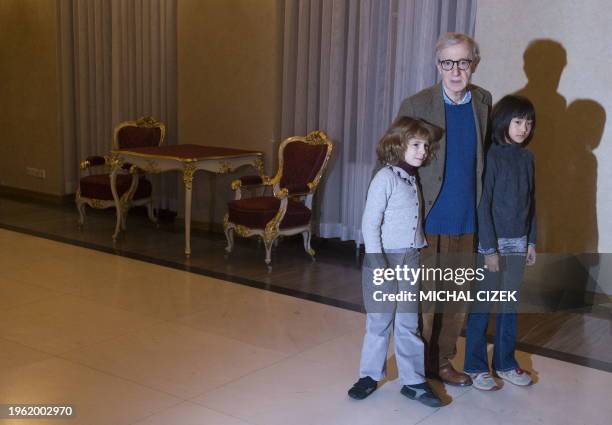 Movie director and actor Woody Allen and his daughters Manzie and Bechet pose for photographers before his meeting with Czech President Vaclav Klaus...