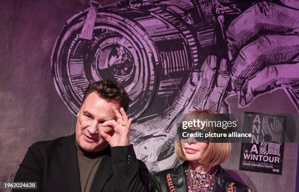 January 2024, Berlin: Fashion designer Guido Maria Kretschmer gestures next to the wax figure of Anna Wintour at her presentation at Madame Tussauds....