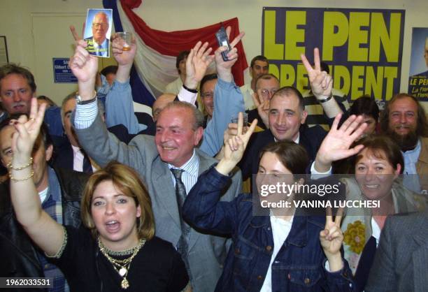 Les militants du Front national laissent exploser leur joie après les premières estimations de résultats du premier tour des élection...