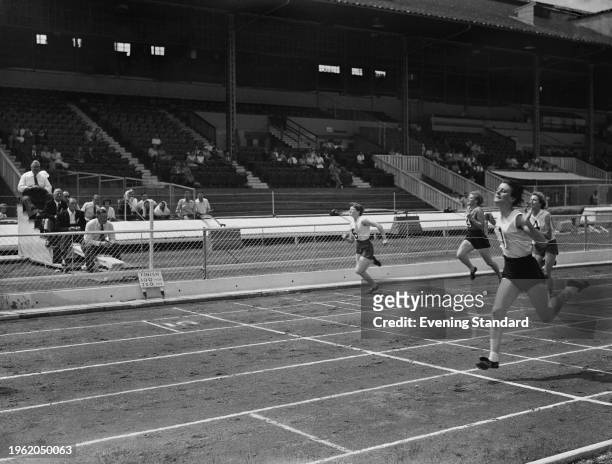 British sprinter Dorothy Hyman winning a race at the Amateur Athletics Association Championships at White City Stadium in London, July 13th 1957.