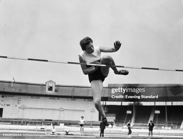 Northern Irish athlete Thelma Hopkins competing in the high jump at the Amateur Athletics Association Championships at White City Stadium in London,...