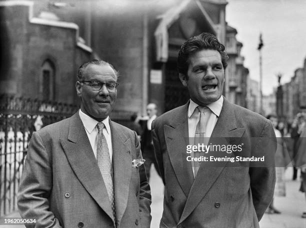 British boxer Freddie Mills with former trainer Nat Sellers outside the Royal Courts of Justice in London, July 17th 1957.