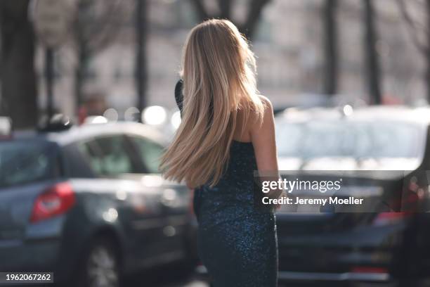 Ginta seen wearing Gaurav Gupta blue sequins pattern off-shoulder bandeau asymmetrical couture long dress, before Gaurav Gupta, during the Haute...