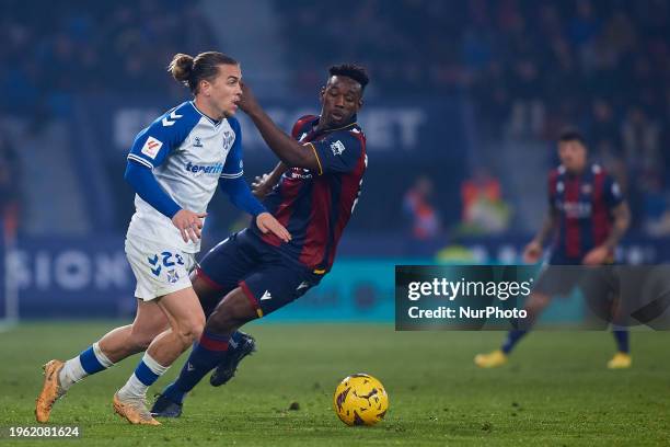 Alvaro Jose Jimenez Guerrero of CD Tenerife competes for the ball with Mohamed Bouldini of Levante UD during the LaLiga Hypermotion match between...