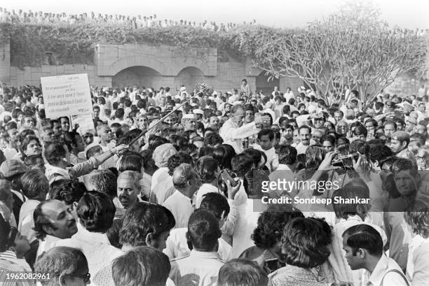 Indian politician and activist Acharya Kripalani acknowledges greetings from a crowd at Raj Ghat, memorial of Mahatma Gandhi where the newly elected...
