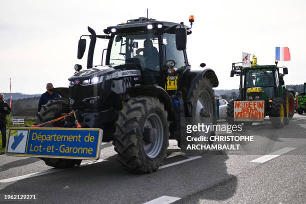 French farmers drive tractors, after calls of the CR47 union to go block the Rungis market, in Cancon, southwestern France, on January 29 amid...