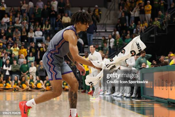 Horned Frogs guard Micah Peavy catches a towel to dry his hands before taking some free throws during the Big 12 college basketball game between...