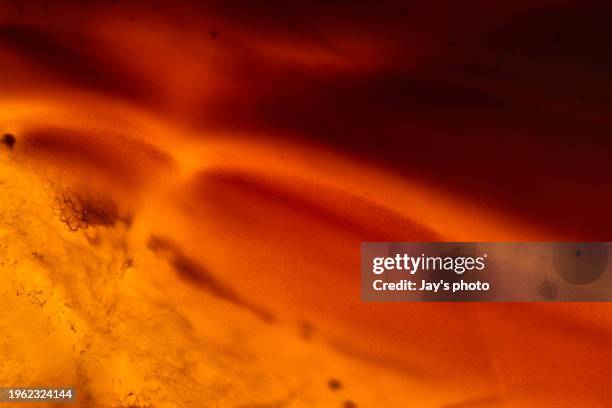 shiny and glittering crystal photo, close-up shot. - amber stock pictures, royalty-free photos & images