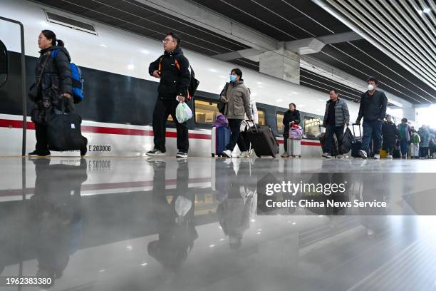 Travelers walk on the platform at Guangzhounan Railway Station on the first day of China's Spring Festival travel rush on January 26, 2024 in...