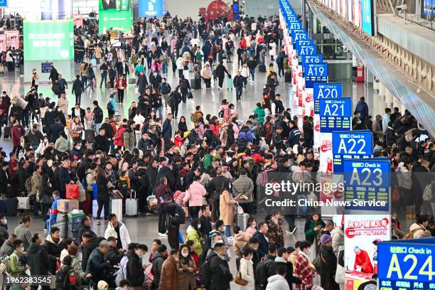 Travelers are seen at the waiting hall of Guangzhounan Railway Station on the first day of China's Spring Festival travel rush on January 26, 2024 in...