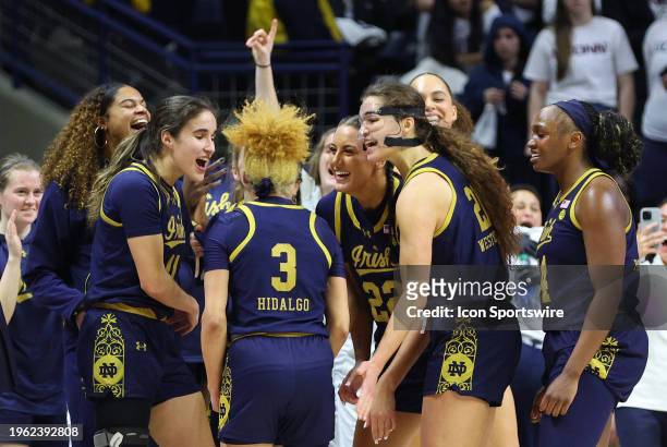 Notre Dame Fighting Irish react after defeating the UConn Huskies during the women's college basketball game on January 27 at Harry A. Gampel...