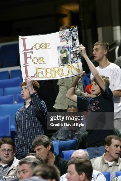 As the Cleveland Cavaliers take on the Toronto Raptors, Cleveland fans hold a sign hoping that the Cavaliers will eventually draft LeBron James of...