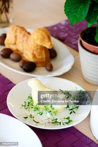 butter in the shape of a lamb on a set easter table - easter lamb stock pictures, royalty-free photos & images