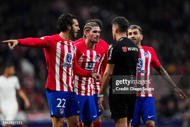 Rodrigo de Paul of Atletico de Madrid argue with referee Gil Manzano during Copa del Rey Round of quarter final between Atletico Madrid v Sevilla FC...