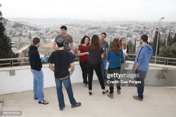 View of a group of students as they talk together outdoors, during a break in classes at the Federmann School of Public Policy and Governance on the...