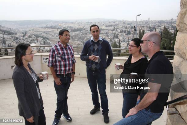 View of a group of students as they talk together outdoors, during a break in classes at the Federmann School of Public Policy and Governance on the...