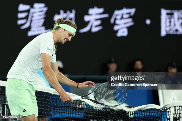 Alexander Zverev of Germany hits the net with his racquet in their Semifinal singles match against Daniil Medvedev during the 2024 Australian Open at...
