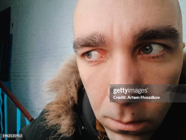 the bald man strongly suspects something - conspiracy theory stock pictures, royalty-free photos & images