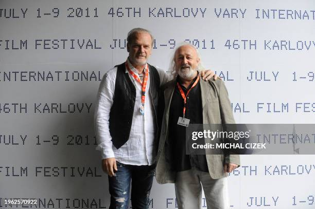 Spanish film director Armendariz Montxo and Spanish actor Lluis Homar pose for photographers prior to their press conference at the 46th Karlovy Vary...