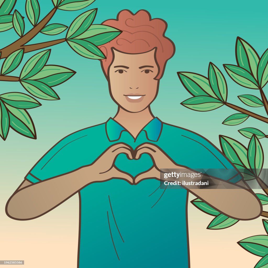 Happy man making heart gesture