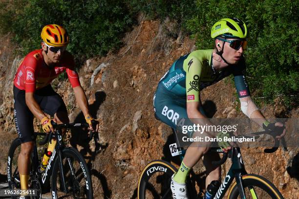 Tobias Halland Johannessen of Norway and Team Uno-X Mobility and Aleksandr Vlasov of Russia and Team BORA - hansgrohe compete in the chase group...