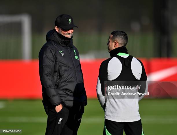 Jurgen Klopp manager of Liverpool Thiago Alcantara of Liverpool during a training session at AXA Training Centre on January 26, 2024 in Kirkby,...