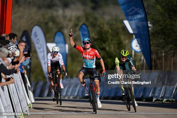 Lennert Van Eetvelt of Belgium and Team Lotto Dstny celebrates at finish line as race winner ahead of Aleksandr Vlasov of Russia and Team BORA -...