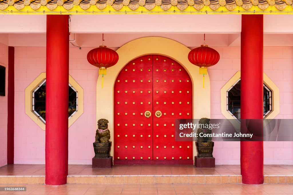 Red Doors at Temple Entrance with Traditional Chinese Lanterns