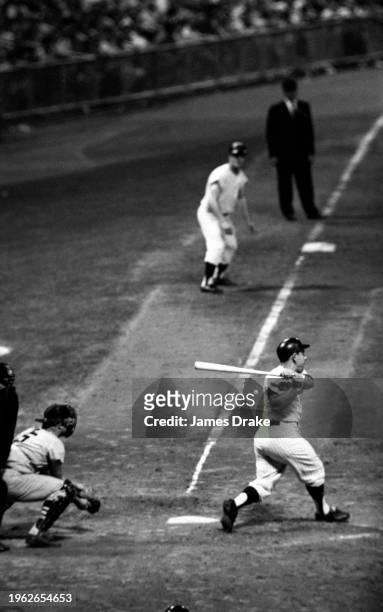 Yogi Berra of the New York Yankees bats during the eighth inning against the Boston Red Sox at Yankee Stadium on June 28, 1963 in New York, New York.
