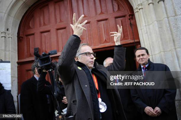 French actor Fabrice Luchini waves as he arrives to attend the Hospices de Beaune's 150th charity auction wine sale, on November 21, 2010 in Beaune,...