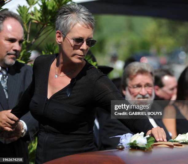 Actress Jamie Lee Curtis places a flower on the casket of her father Hollywood legend Tony Curtis at the Palm Mortuary and Cemetery, Green Valley in...