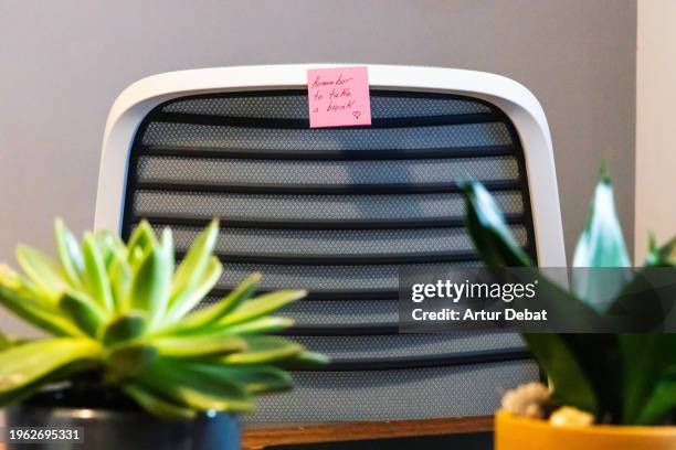 adhesive note in a chair office home with a motivation phrase. - heart chair design stock pictures, royalty-free photos & images