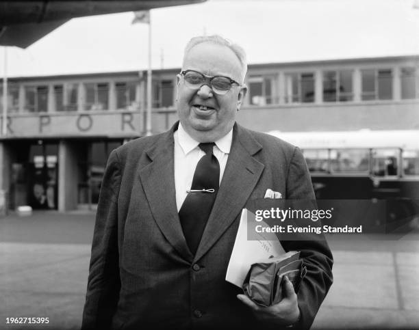 Lieutenant Harold Auten VC , formerly of the Royal Navy Reserve, arriving at London Airport from the United States, June 28th 1956. Auten is in...