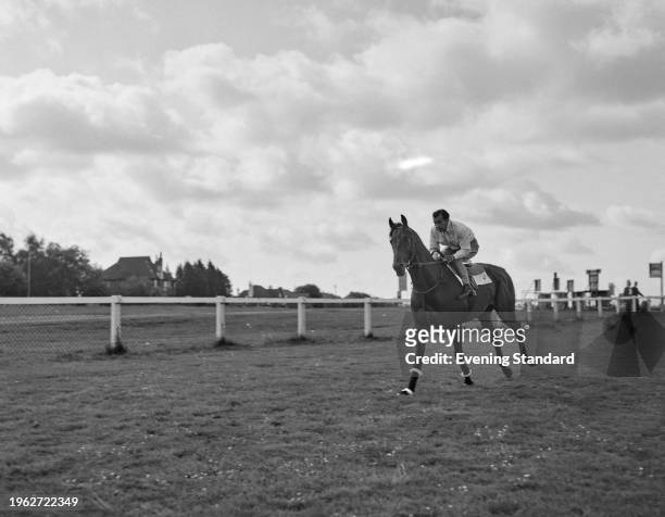 Australian jockey Rae Johnstone riding on French thoroughbred horse 'Lavandin', winner of the 1956 Epsom Derby, Surrey, June 1956.
